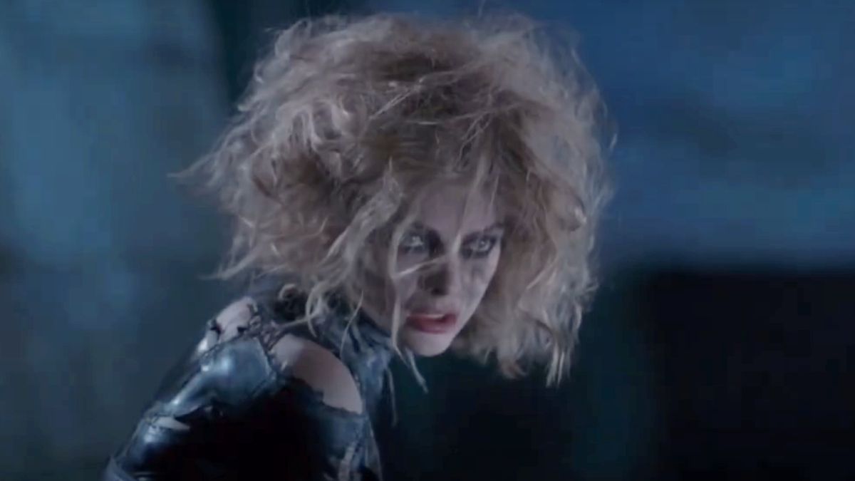 Michelle Pfeiffer with wild hair scowling in Penguin&#039;s lair in Batman Returns