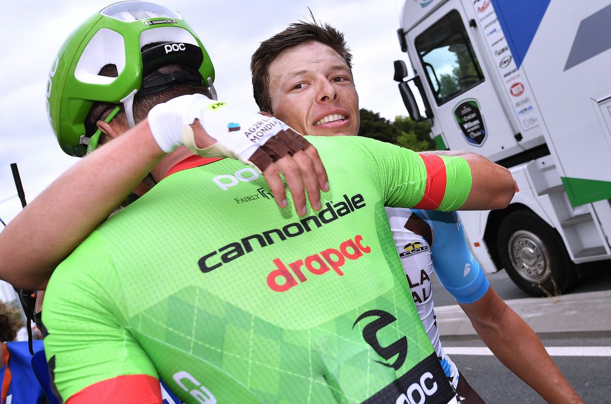 Oliver Naesen (AG2R) receives a hug from Vanmarcke