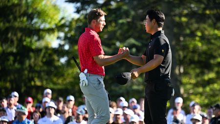 Sam Burns and Tom Kim shake hands at the Presidents Cup