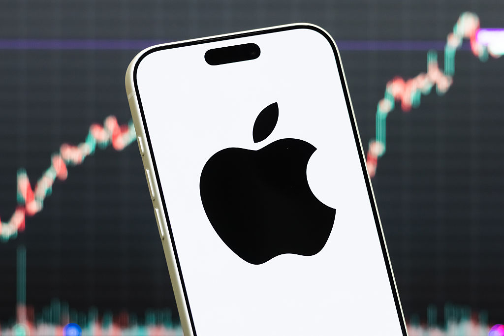 A smartphone displays the logo of Apple Inc. (NASDAQ: AAPL) in front of a screen showing the company&amp;rsquo;s latest stock market chart on July 23, 2026