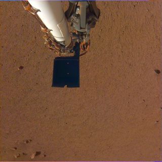 NASA's Mars InSight lander photographed its robotic arm and the Martian soil near its landing site on Dec. 4, 2018.