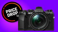 OM System OM-5 Mark II camera with Price Drop badge on purple backdrop