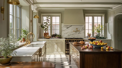 big traditional kitchen with large butcher block island and soft, neutral toned cabinets