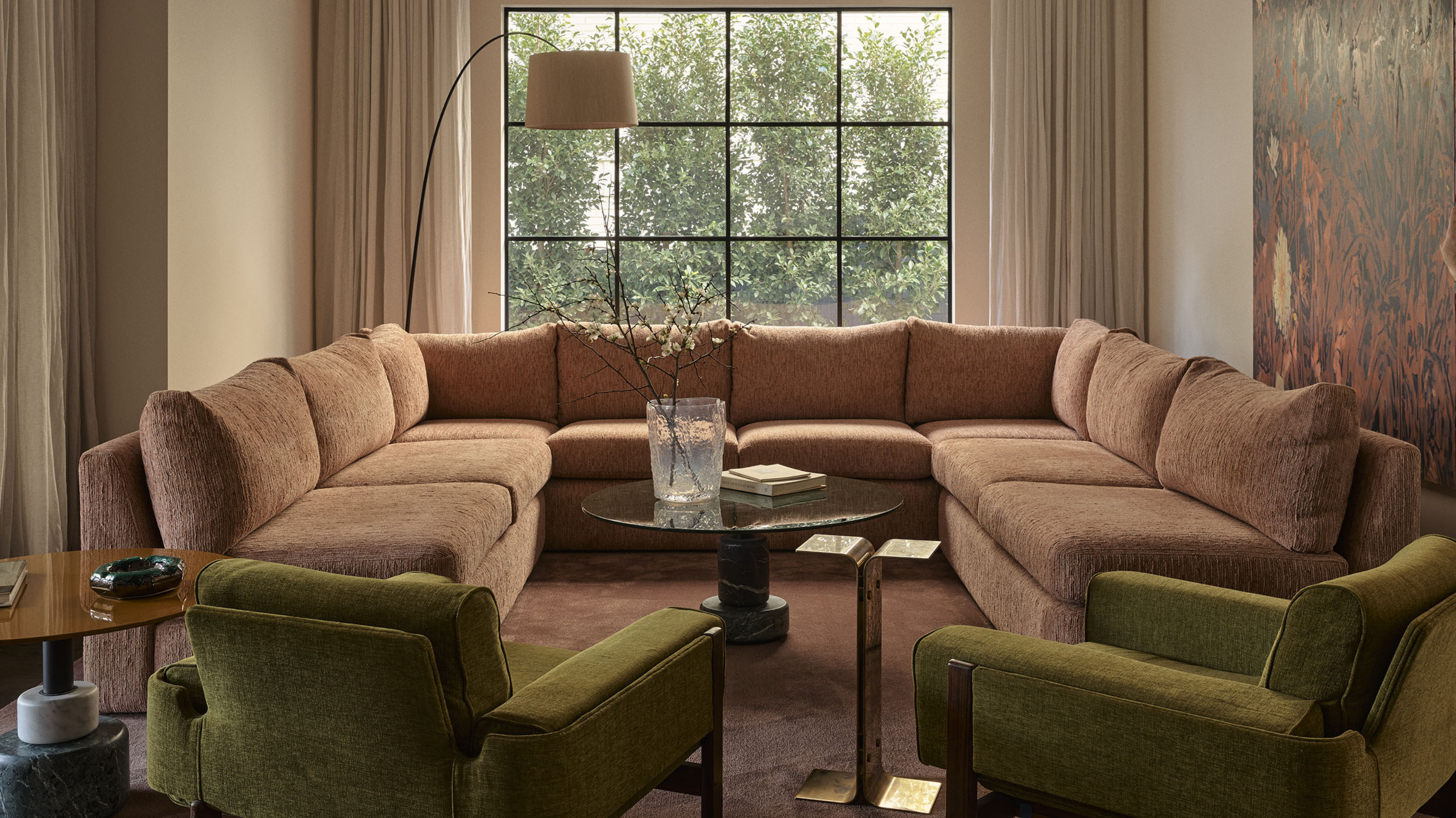 Living room in Smac Studio's renovated Art Deco home in Woollahra, Sydney, featuring a Pierre Augustin Rose sectional sofa.