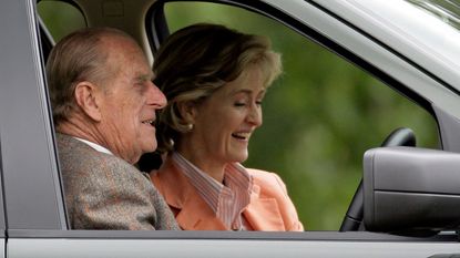Penelope Knatchbull and Prince Philip sat inside a car
