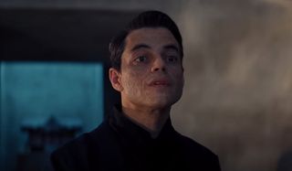 No Time To Die Rami Malek lifts his face in conversation