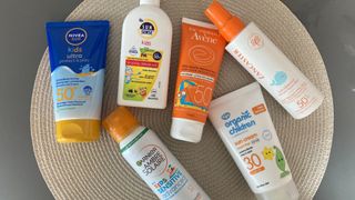 a selection of the best sunscreen for kids tested by beauty editor, Stephanie Maylor