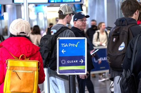 Travelers in line, waiting in TSA Precheck and Clear lanes