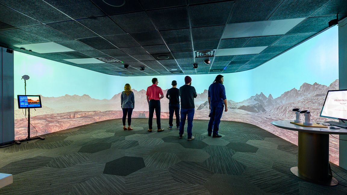 People stare at an immersive display from Scalable Display Technologies.