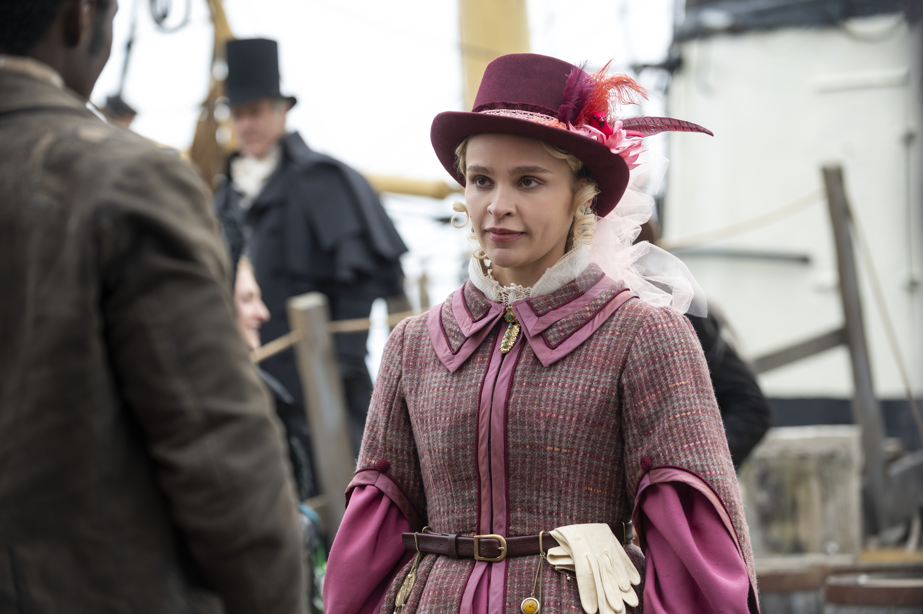 A woman (Iola Evans as Tanna) wearing an 1837 travel outfit while disembarking a boat, in 'Washington Black.'