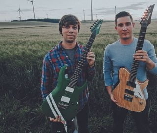 August Burns Red’s JB Brubaker (left) with his Ibanez RGA121 (now available as a signature model, the JBBM20) and Brent Rambler with his Ibanez Custom Shop FR model
