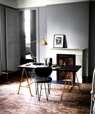 Grey room, trestle table, designer chair