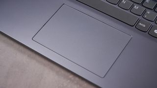 Close-up of touchpad on Lenovo LOQ Essential Gen 9, open on desk