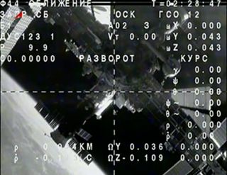 The International Space Station and Earth appear in the camera eye of a Russian Soyuz TMA-09M spacecraft after the two vehicles undocked on Nov. 10, 2013 to return the Olympic torch and three Expedition 37 crewmembers back to Earth.