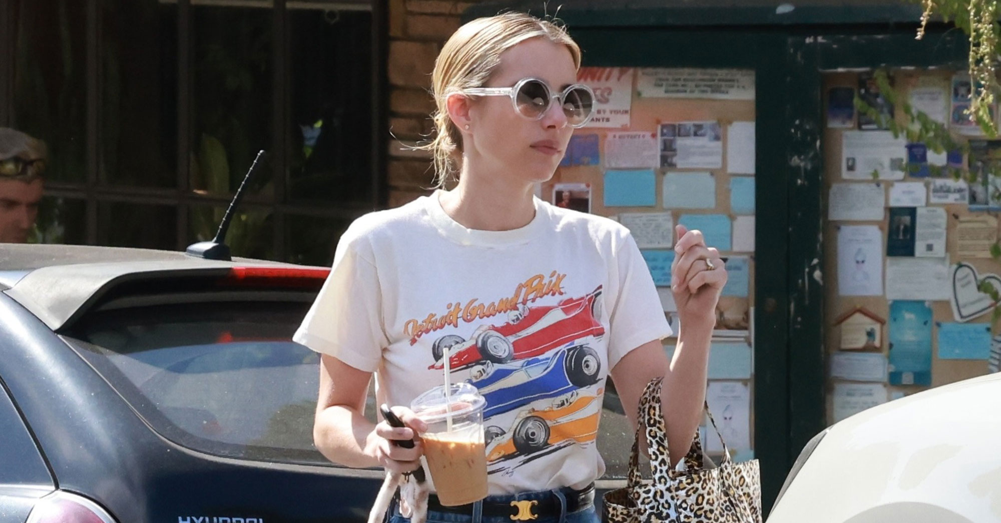 Emma Roberts wears jeans and Maison Margiela floral Tabi shoes.