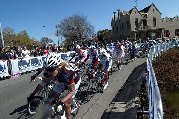 The women's peloton corner in-front of the local pub in Buninyong, still around three minutes behind a leading trio.