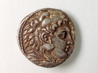 The face of Heracles on a coin found at the farmhouse suggests the Greeks had influence over the area 2,800 years ago.