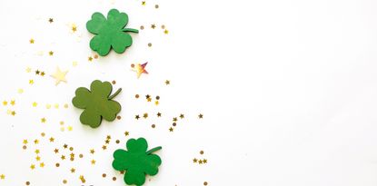 Green Clovers or Shamrocks and confetti white Background for St. Patrick's Day Holiday