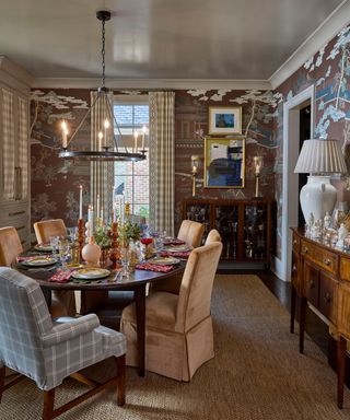 Dining room with wallpaper and table set for the holidays