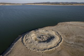 The Dolmen of Guadalperal, sometimes also known as "The Spanish Stonehenge" is seen above the water level at the Valdecanas reservoir, which is at 27% capacity, on July 28, 2022 in Caceres province, Spain.