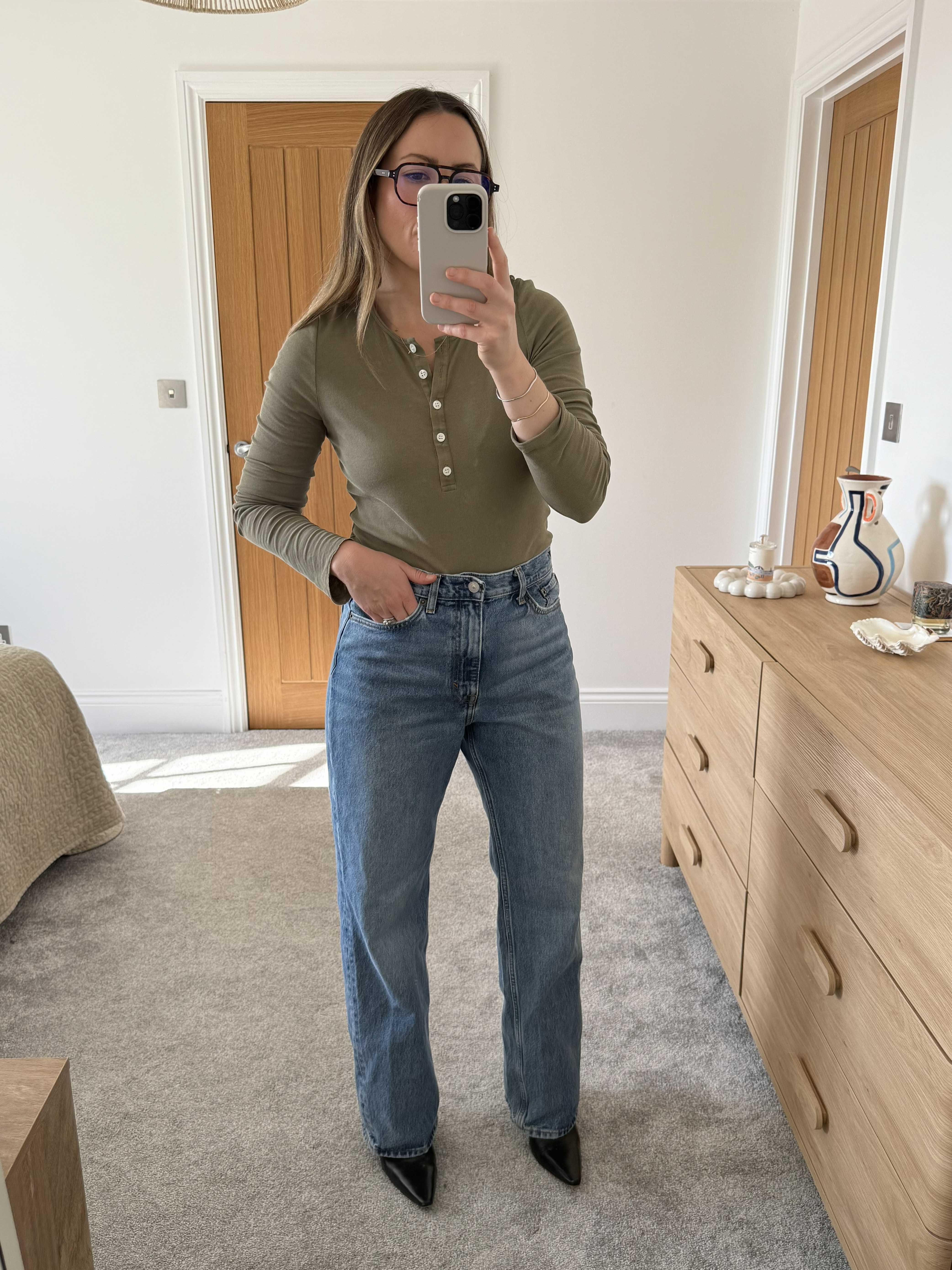 woman wears cos jeans