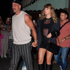 Taylor Swift and Travis Kelce on a date to Lucali pizza where swift wears classic black boots