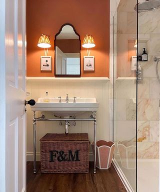 Bathroom with orange walls and white sink