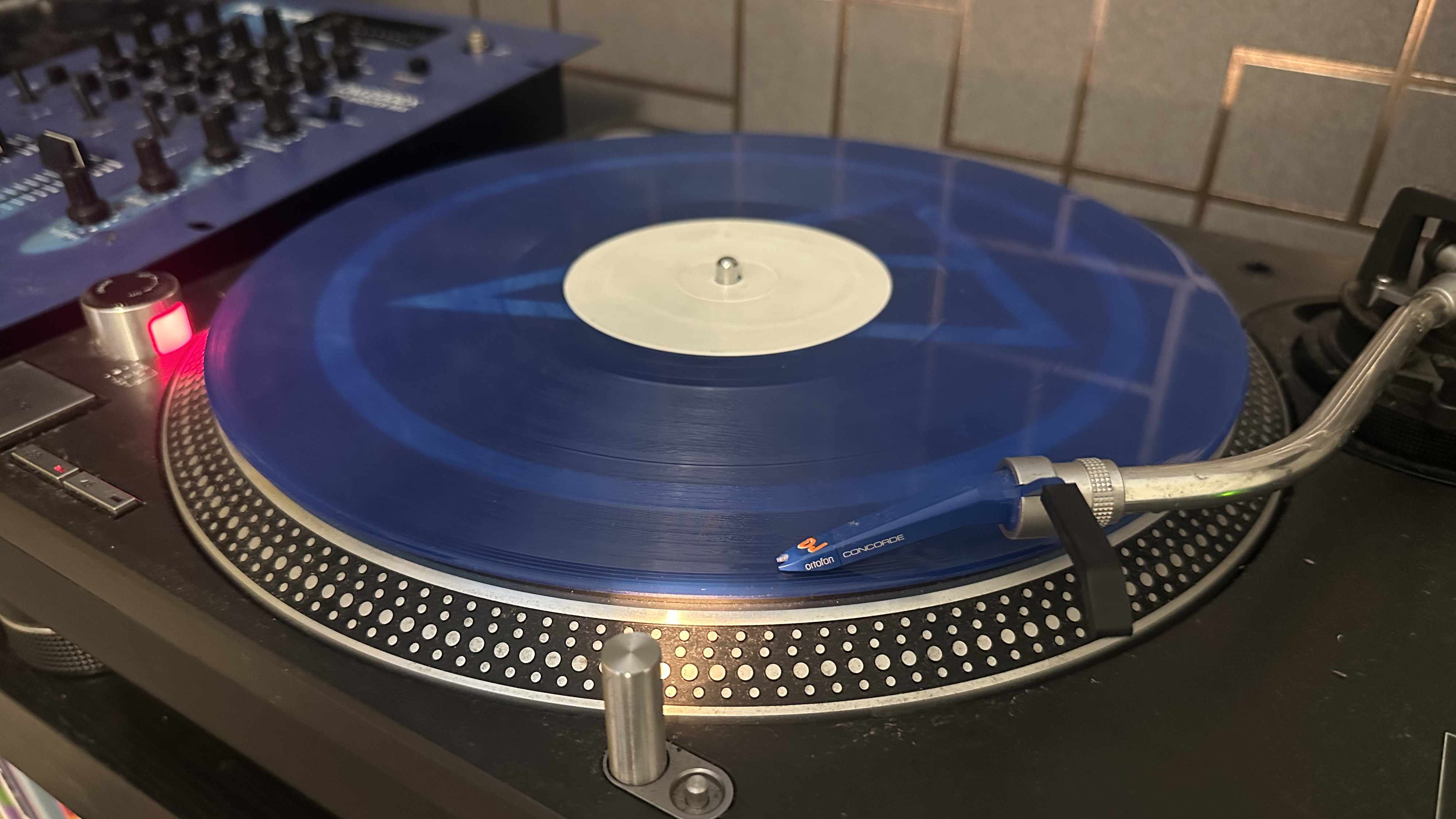 blue vinyl record on a turntable