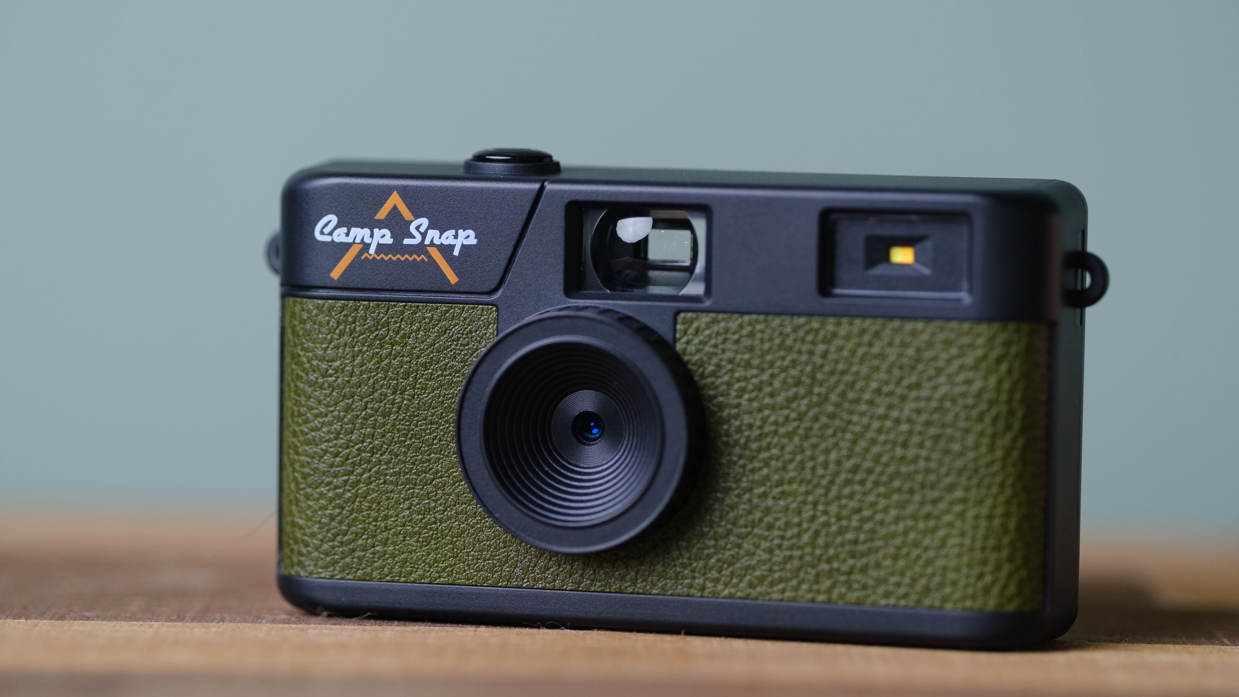 The Camp Snap, in forest green, sits on a table