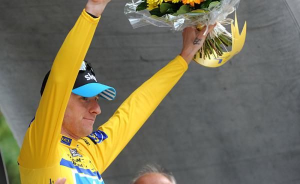 Bradley Wiggins (Sky) in yellow on the podium