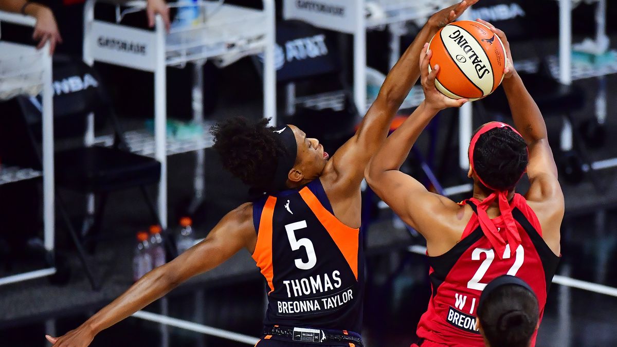 A&#039;ja Wilson of the Las Vegas Aces draws the foul from Jasmine Thomas of the Connecticut Sun during the second half of Game Three of their Third Round playoff at Feld Entertainment Center on Sept. 24, 2020 in Palmetto, Florida.