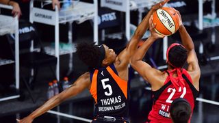 A'ja Wilson of the Las Vegas Aces draws the foul from Jasmine Thomas of the Connecticut Sun during the second half of Game Three of their Third Round playoff at Feld Entertainment Center on Sept. 24, 2020 in Palmetto, Florida.