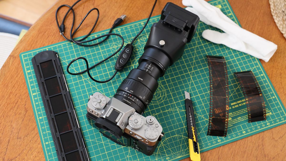 JJC Film Digitizing Adapter Set attached to a Fujifilm X-T5 camera on a green lined cutting mat