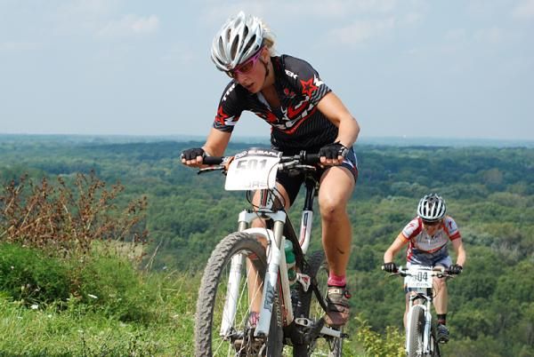 Ladies winner Abby Strigel (Trek Stores of Madison) is chased by second place Lisa Krayer (Adventure 212/Specialized) halfway up Crystal Ridge.