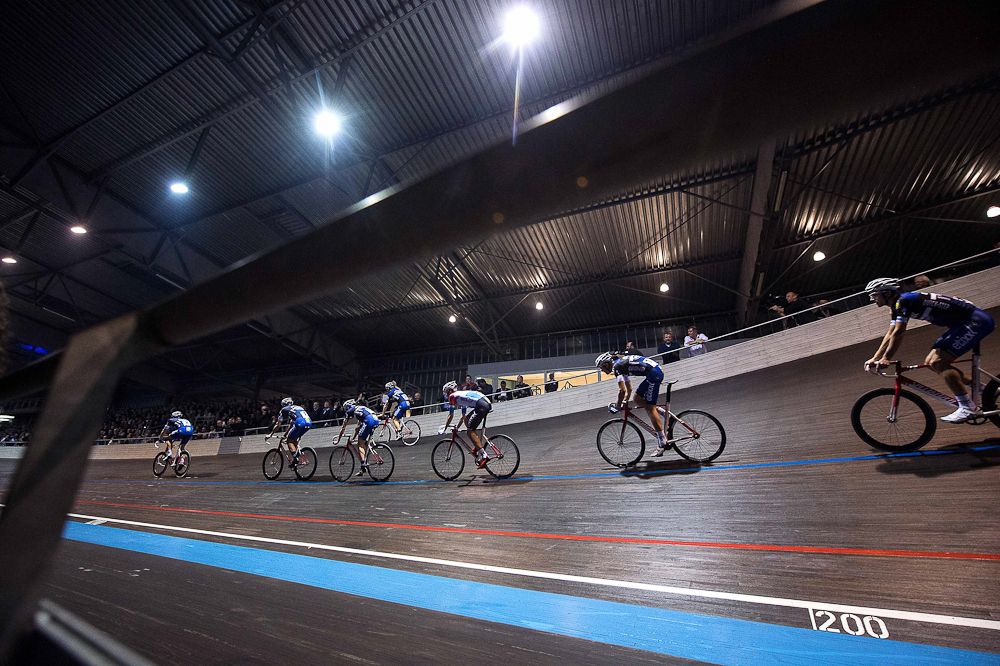 Riders circle the track at the Etixx-QuickStep team presentation.