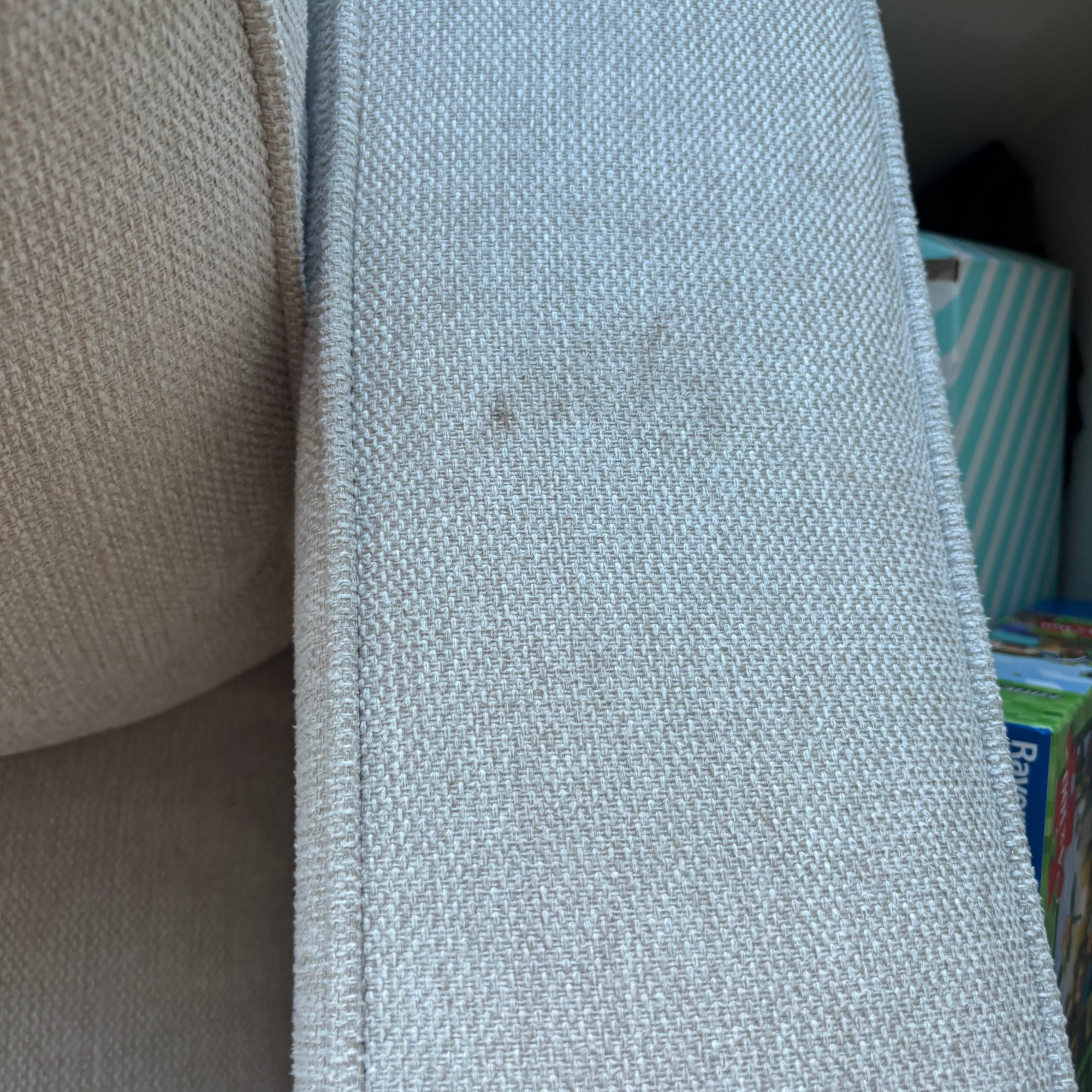 cream arm chair rest with visible marks before using Rug Doctor Deep Upright Carpet Cleaner review 