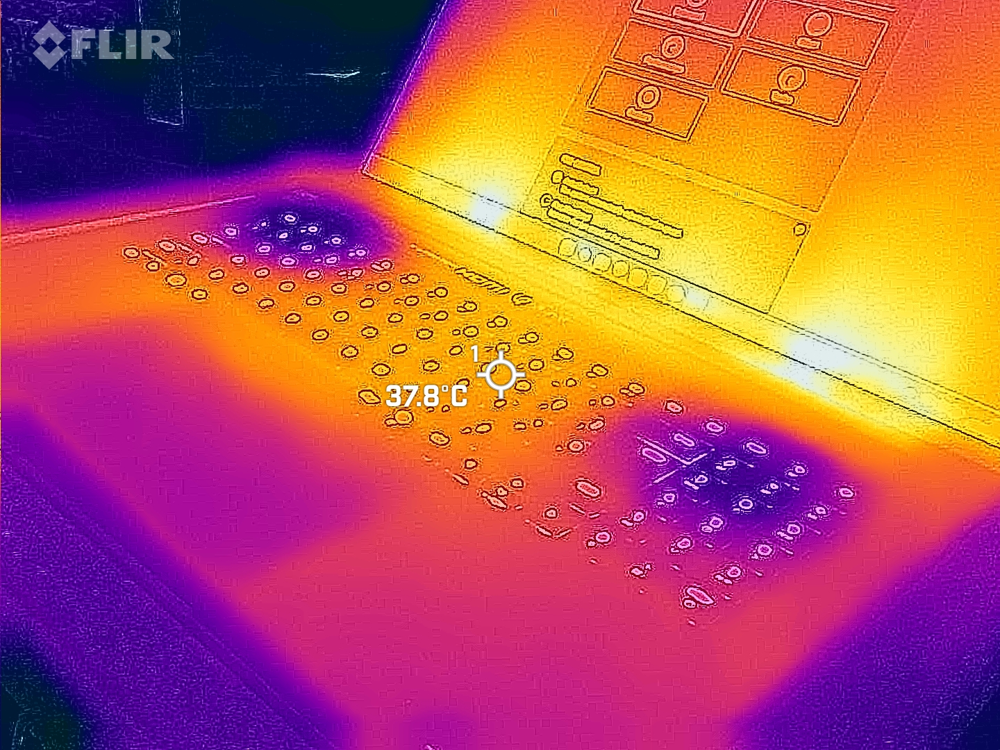 Razer Blade 18 (2025) gaming laptop viewed with a FLIR thermal camera showing hot and cool spots