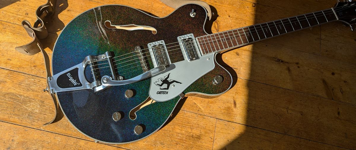 A Gretsch Electromatic John Gourley Broadkaster lying on a wooden floor