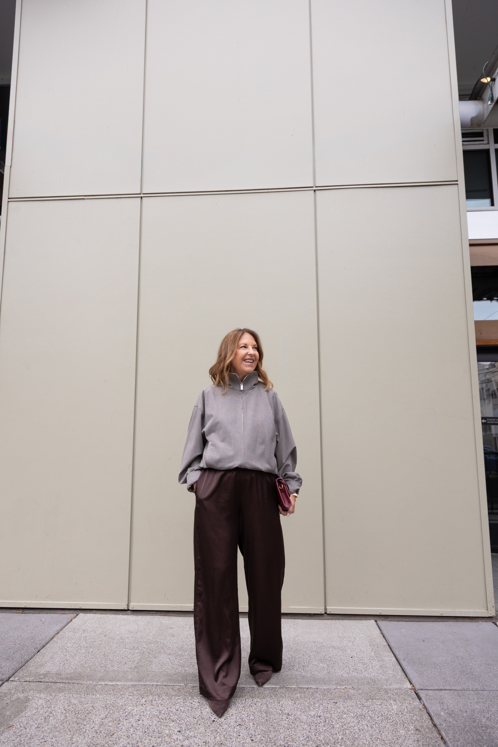 Sandy Koszarek wearing a track jacket and brown trousers.