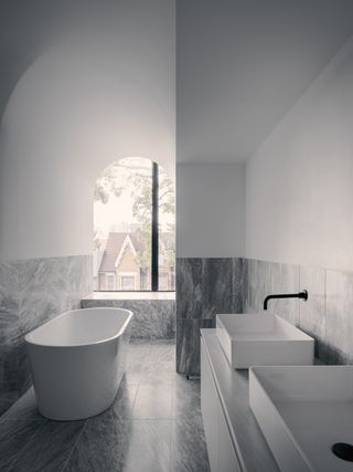 Grey contemporary bathroom in toronto home by JA architecture studio