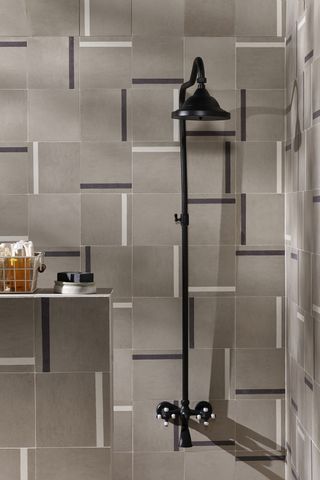 Small bathroom tile ideas A monochrome tiled shower with graphic tiles