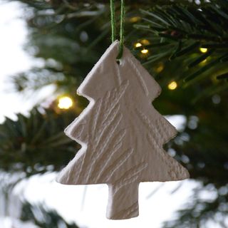 Air dry clay embossed Christmas tree decoration.