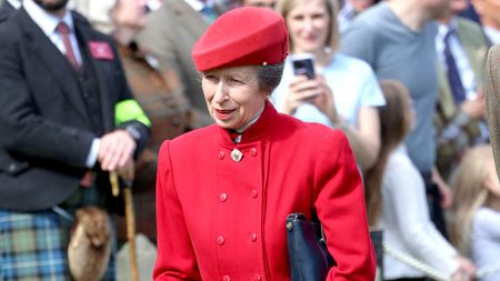 Princess Anne, wearing a red coat, attends The Braemar Gathering 2023 