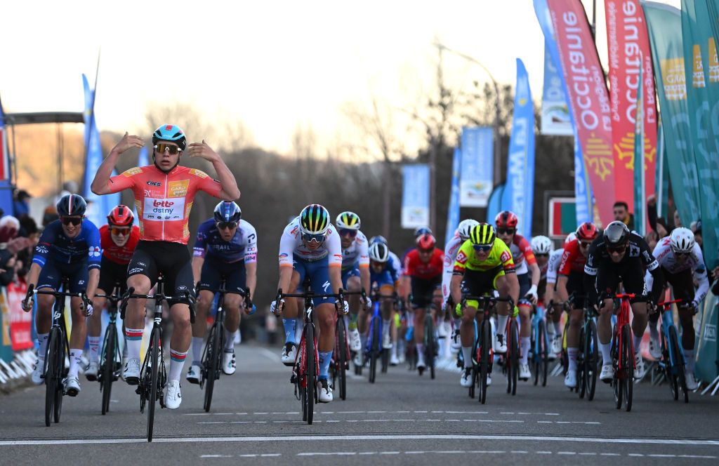 BESSEGES FRANCE FEBRUARY 03 Arnaud De Lie of Belgium and Team Lotto Dstny Orange leader Jersey celebrates at finish line as stage winner ahead of Samuel Watson of United Kingdom and Team GroupamaFDJ and Valentin Ferron of France and Team TotalEnergies during the 53rd Etoile de Besseges Tour Du Gard 2023 Stage 3 a 16971km stage from Bessges to Bessges EDB2021 on February 03 2023 in Besseges France Photo by Luc ClaessenGetty Images