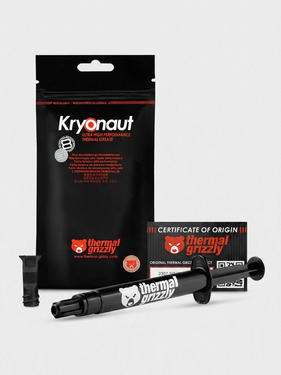 Thermal Grizzly Kryonaut thermal paste and application tools on a grey background