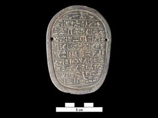 The heart scarab contains an Egyptian hieroglyphic inscription that is being studied.