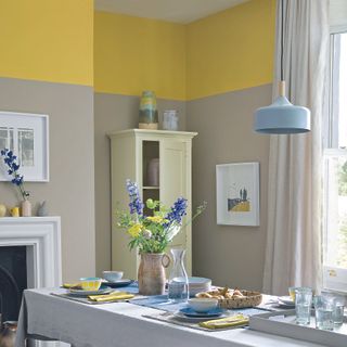 Living room with two tone beige and yellow paint on walls