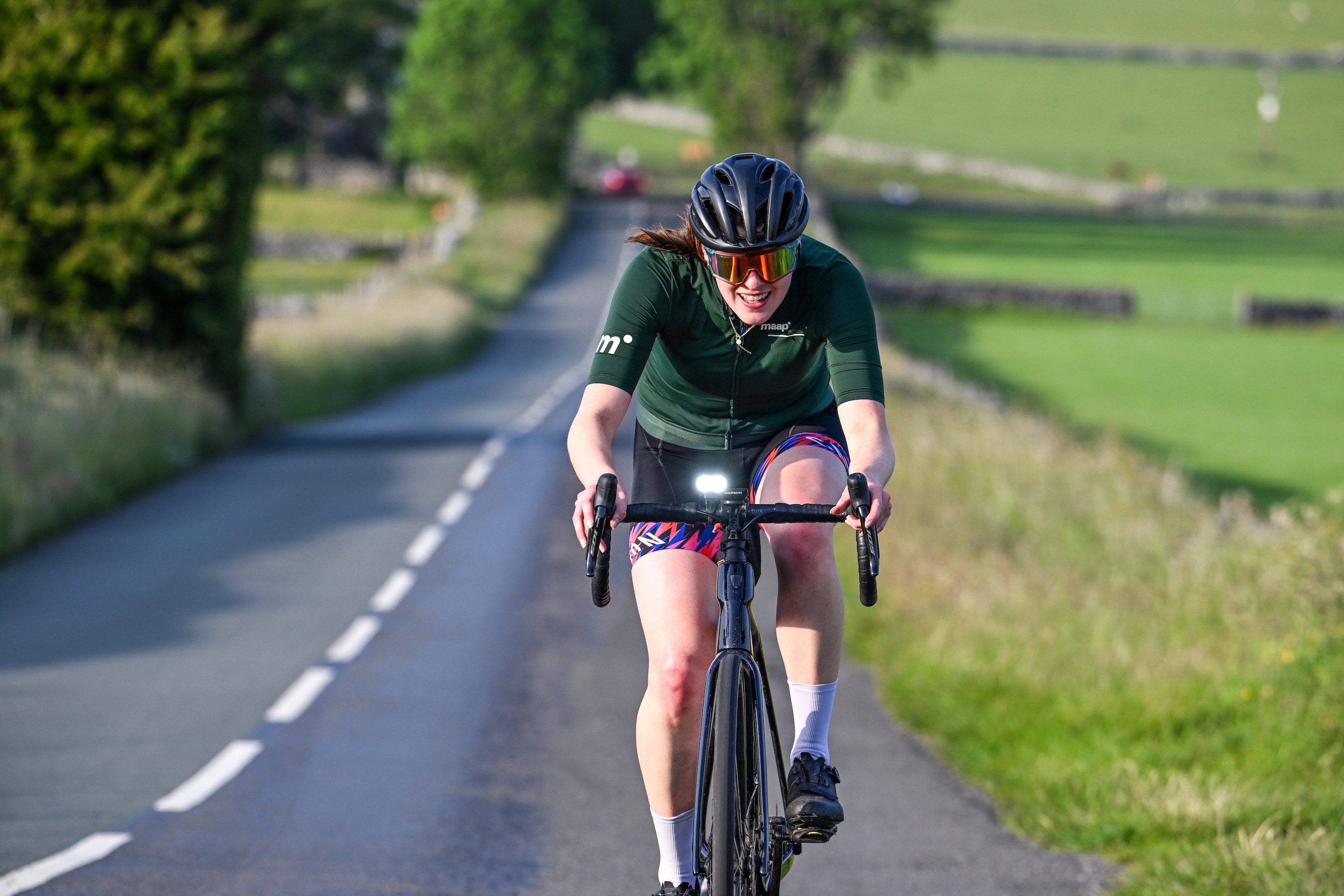 A rider time trials on a road bike
