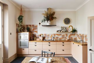 a kitchen with patterned encaustic tiles