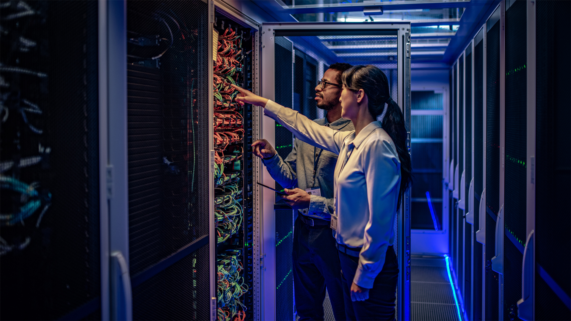 two technicians working in a data center